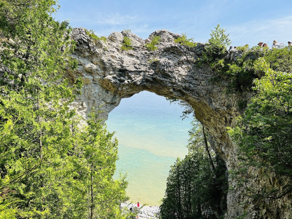 Arch Rock limestone arch framing turquoise Lake Huron water below