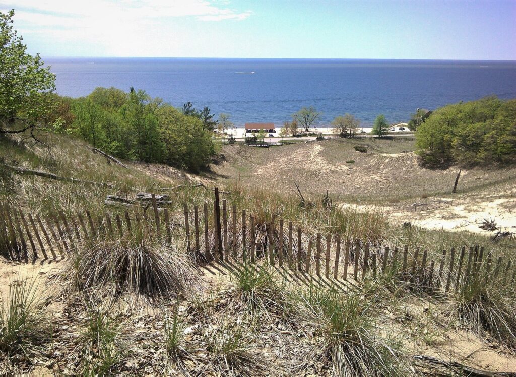 View over dune grass and a sand fence to Lake Michigan at North Beach Park near Ferrysburg